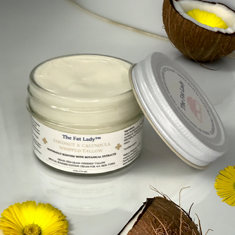 Organic coconut and calendula whipped tallow moisturizer by The Fat Lady, showing creamy texture with coconut and calendula ingredients.